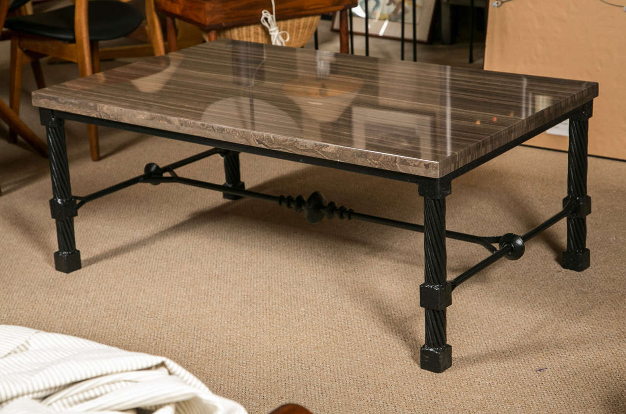 A wrought iron coffee table with 