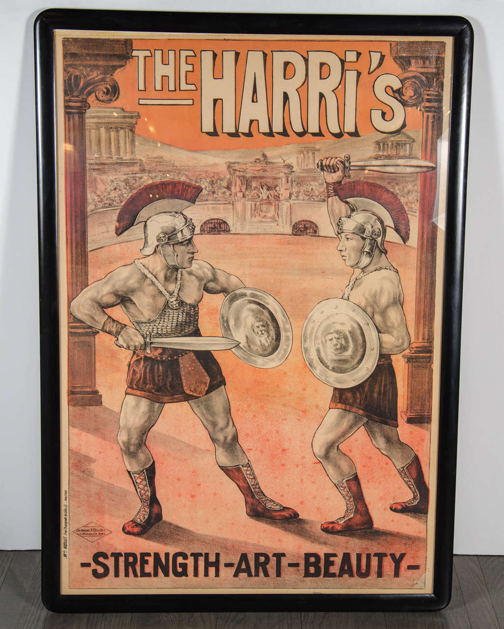 This original French Art Deco poster features two Neo-classical Roman gladiators in combat.It is done in rich tones of burnt umber and brown and grey.The piece is museum framed in black lacquer and dated 1925 as well.