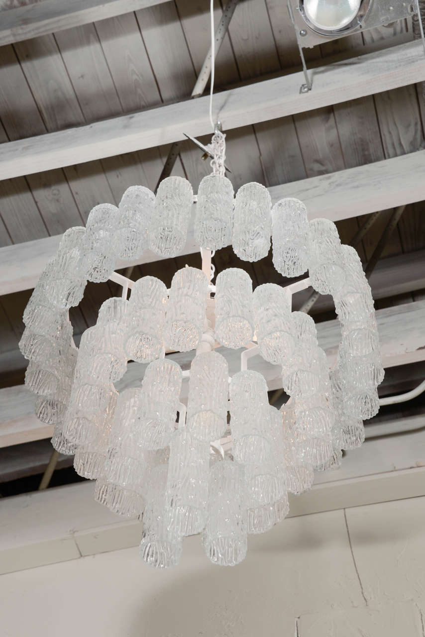 Vintage 4-tiered chandelier, featuring hand-blown tronchi style glass shades that hang from its circular painted metal frame, newly rewired and ready to install.