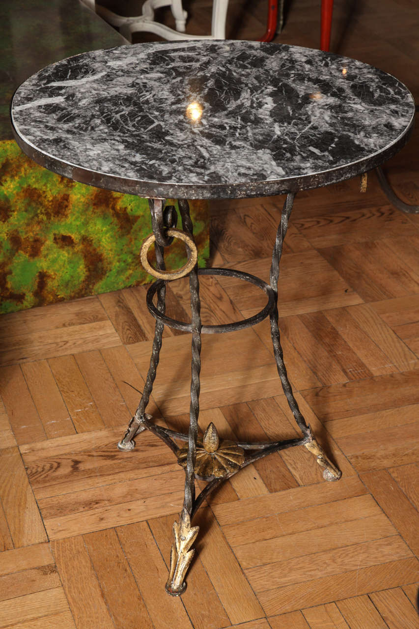 A Wrought Iron and Parcel Gilt Decorated Marble Topped Gueridon In Good Condition For Sale In New York, NY