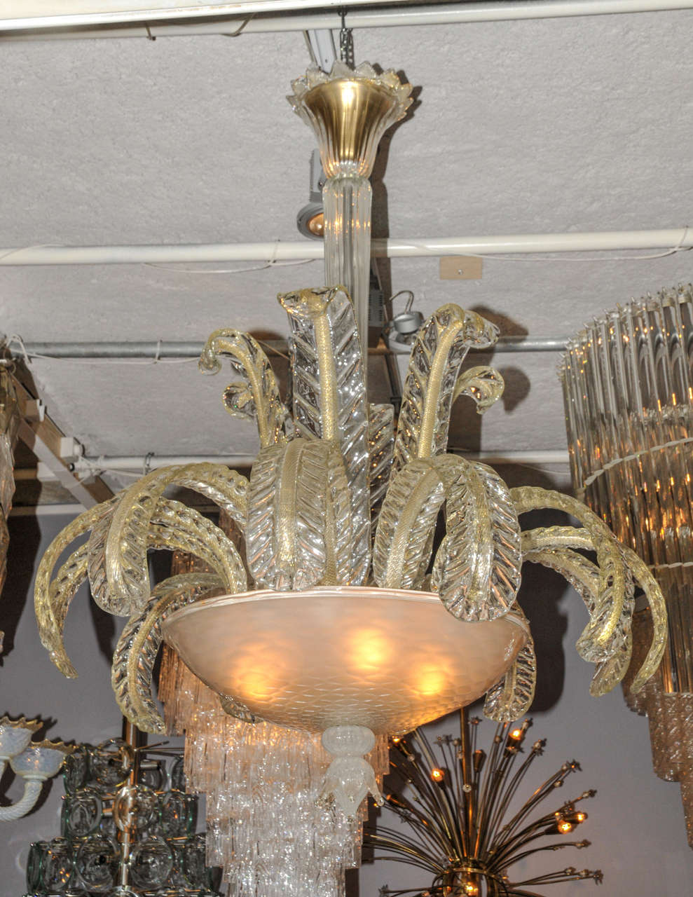 1950-1960's Fountain Murano chandelier in Murano glass with gold glittered finish attributed to Barovier. Wired for European use. Good condition. Normal wear consistent with age and use.