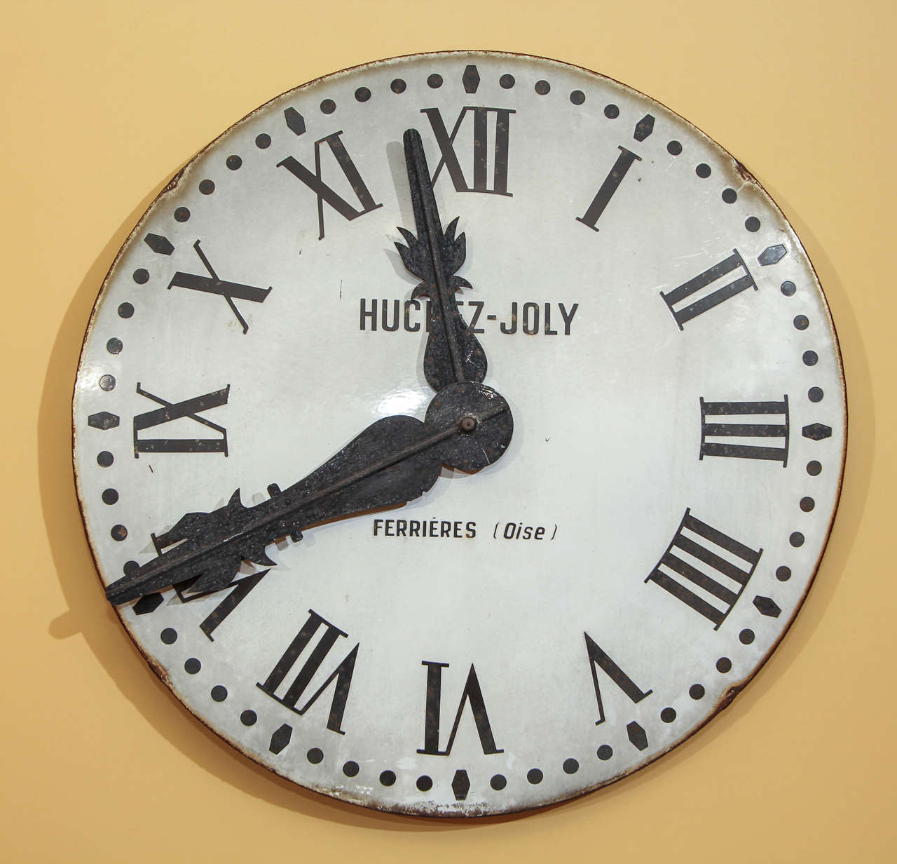 French tower clock face.

This is a decorative enamel clock face from the Ferrieres (Oise) area in France made by the Huchez-Joly company.

It features a white enamel face with the black Roman numerals and the original black iron hands.

It is