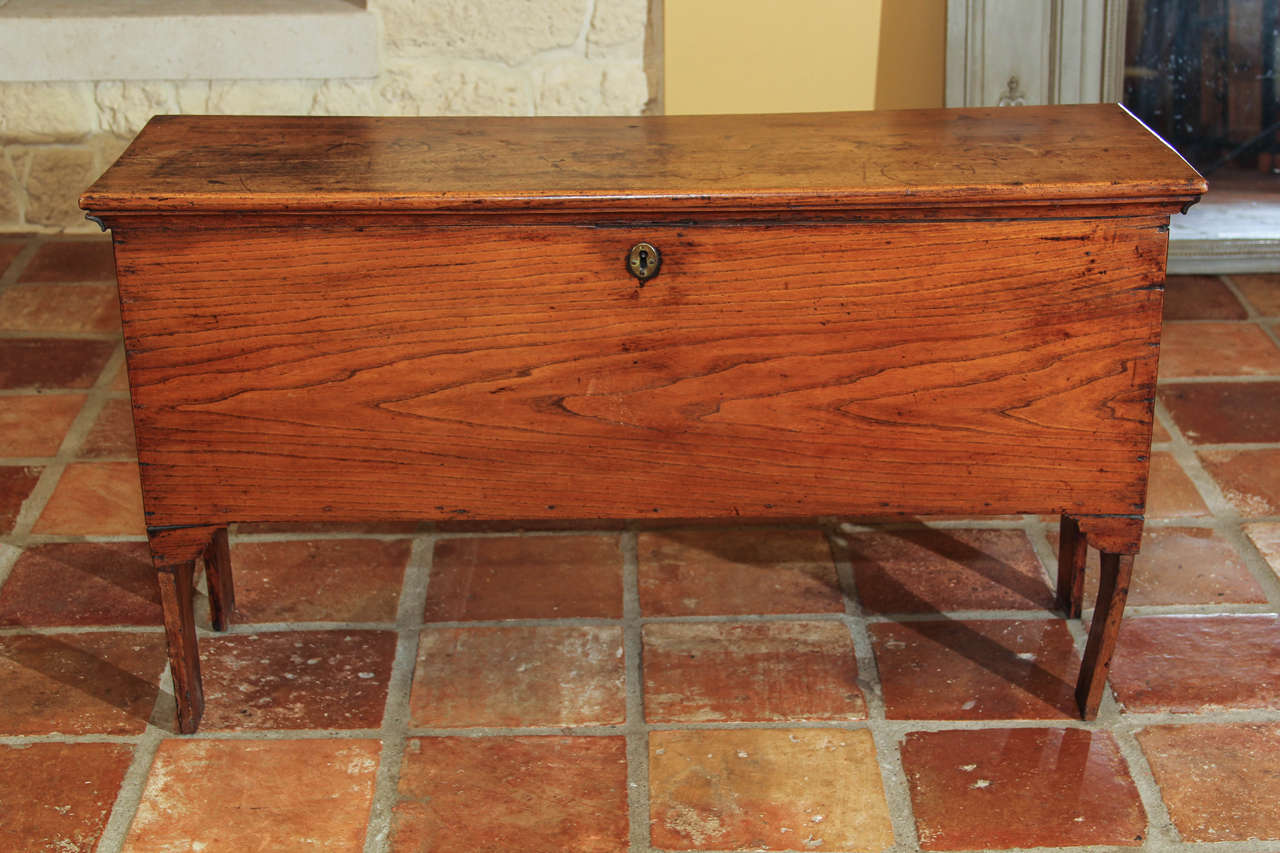 English Elm Coffer

This is an early English small blanket chest which has a soft warm patina.  It is a small coffer made with six wide boards and is what they call a six board chest.  The whole top is one board, each side is one board and so