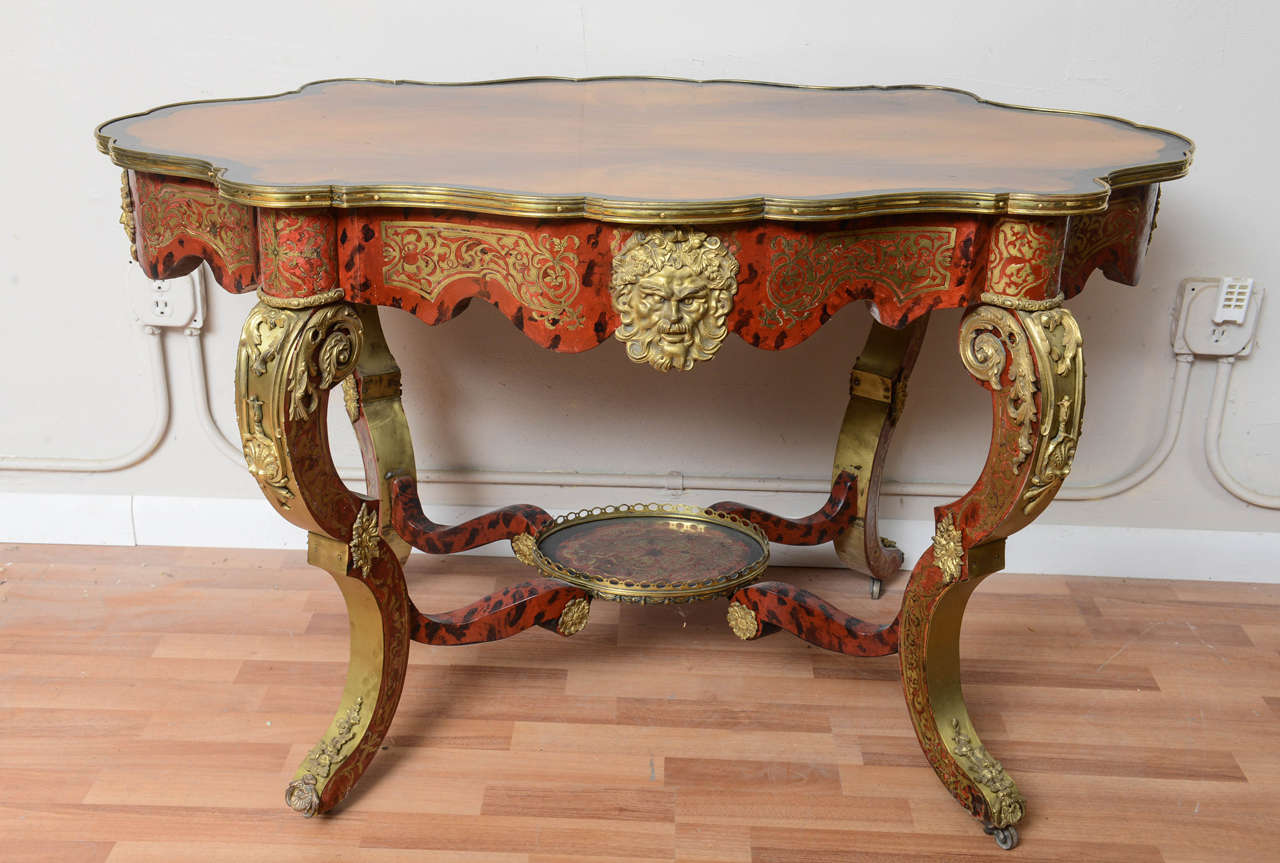 Outstanding 18th century French Boulle Table with veneered walnut top and tortoise shell applied throughout. Fitted with outstanding Bronze Ormolu and brass inlaid.Would also make a lovely desk, hall center table or a console.