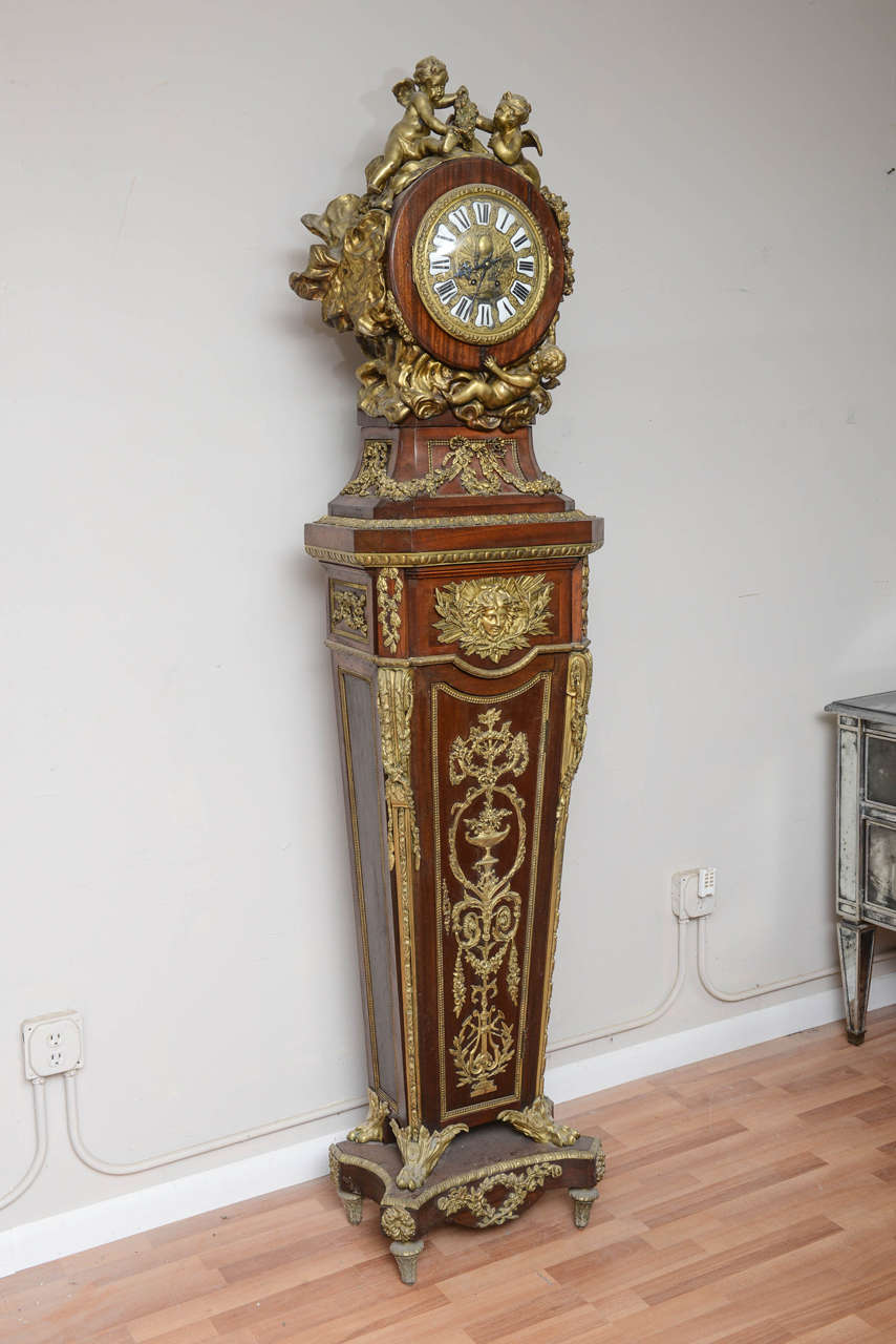 Rare Louis XIV style bronze ormolu floor Cartel with chime. Good working condition French Cartel adorned with angles and fitted with enamel numbers on face. Signed Vincenti 1855 on works. Clock works cleaned and in excellent condition. Clock case
