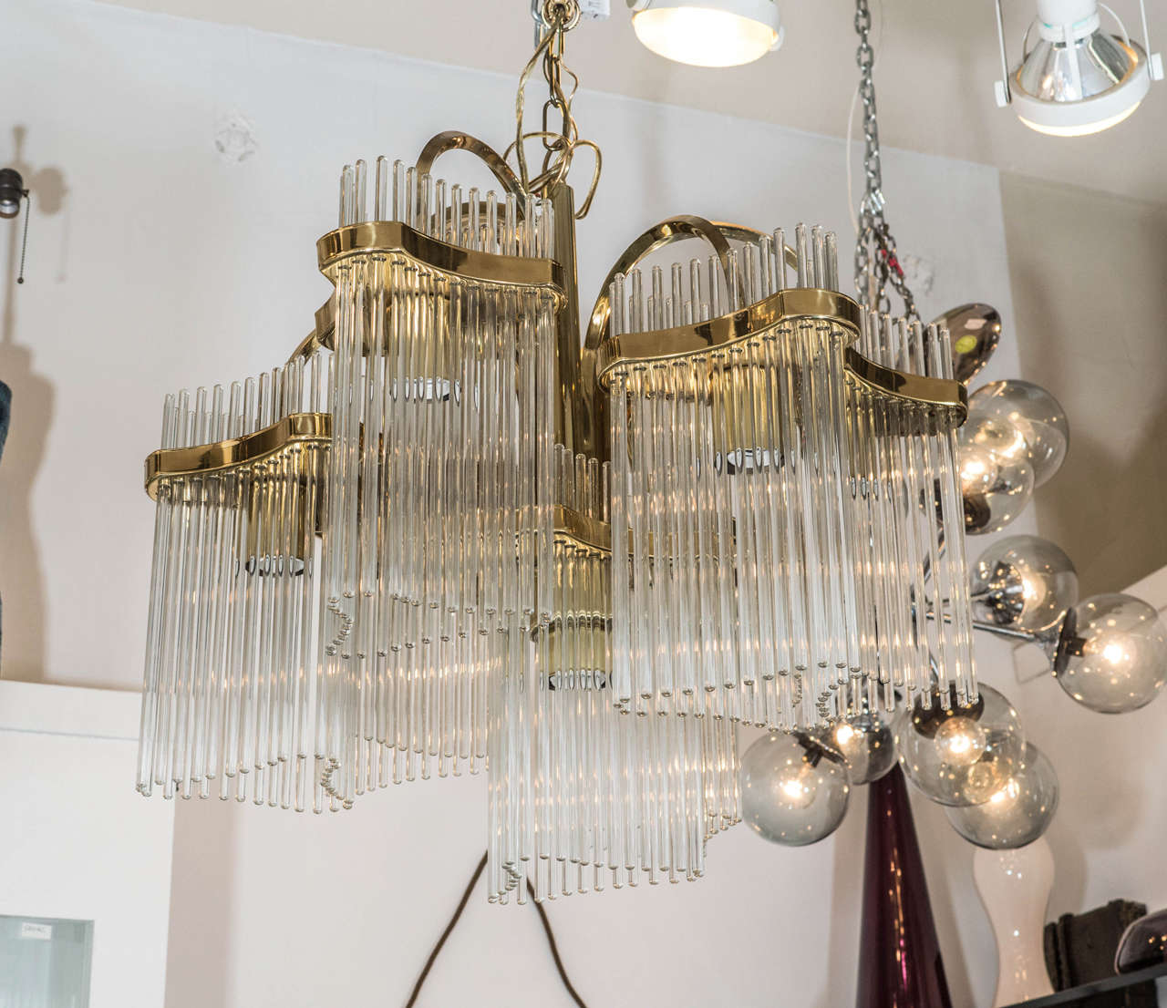 A vintage six-arm brass and glass rod chandelier by Gaetano Sciolari for Lightolier.

Reduced From: $3,200