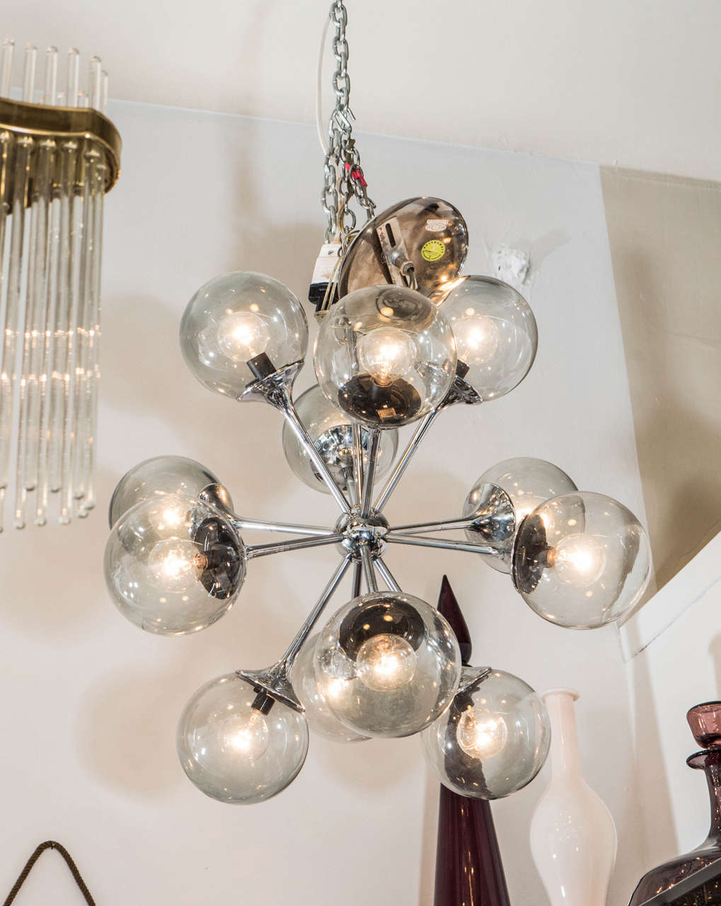 A vintage Sputnik 12-arm chandelier with bubble shaped smoked glass globes on a chrome frame by Lightolier.