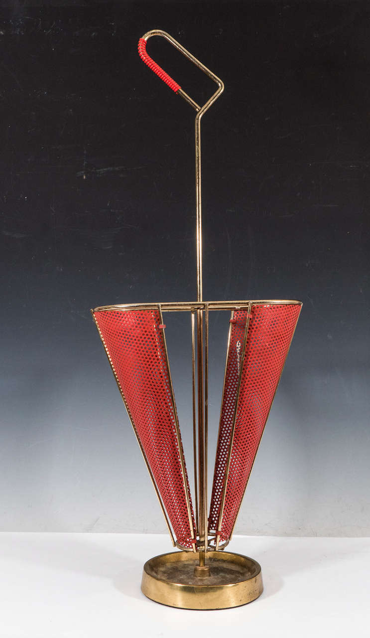 A vintage perforated red enamel and brass-plated Italian modernistic umbrella stand.