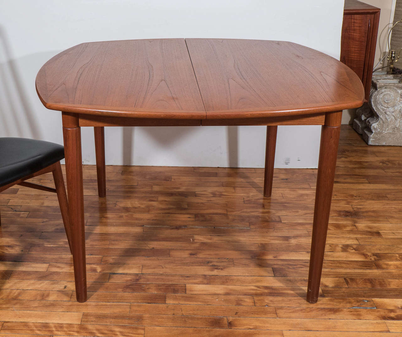 A Danish modern Koefoeds Hornslet teak extension dining table with two leaves  The two 18