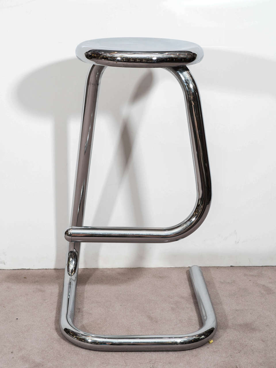 A vintage pair of chrome paper clip form, tubular bar stools, produced circa 1970s for Kinetics Furniture. Good vintage condition with some age appropriate wear.