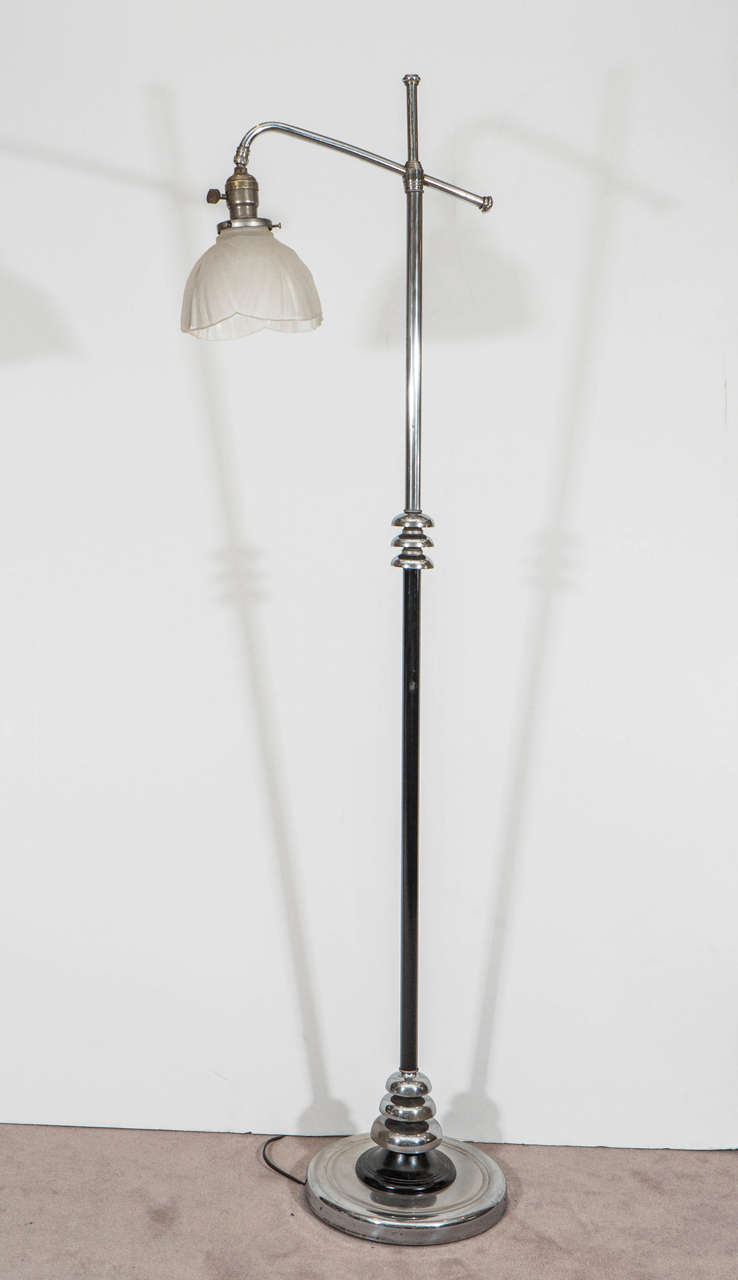 An Art Deco chrome and painted black metal floor lamp with original glass shade. Newly Rewired.