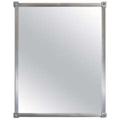 A Sherle Wagner Art Deco Style Wall Mirror in Brushed Nickel