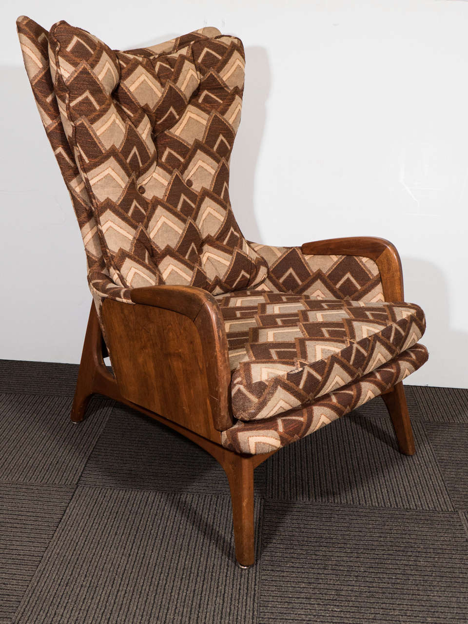 A vintage Adrian Pearsall wingback lounge chair, with button tufted geometric pattern upholstery in varying shades of brown. Good vintage condition with age appropriate wear.