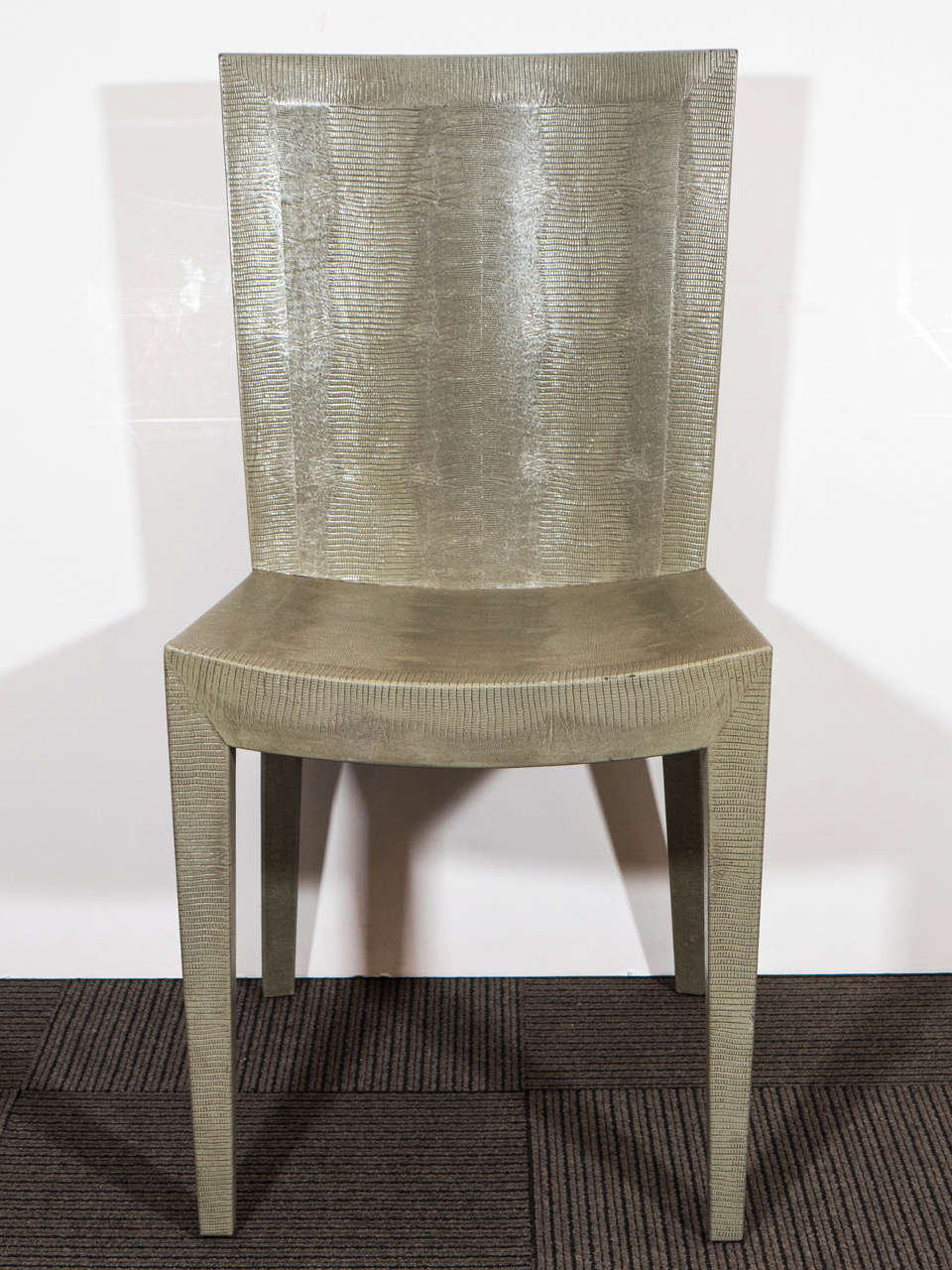 A Beautiful Set of Six Karl Springer Faux Lizard Skin Dining Chairs in a Fantastic Pale Olive Color Accented with Black Great Striations and Detail to the Skin. Signed, and Dated 1983 on a piece of tooled leather attached to the Bottom of each