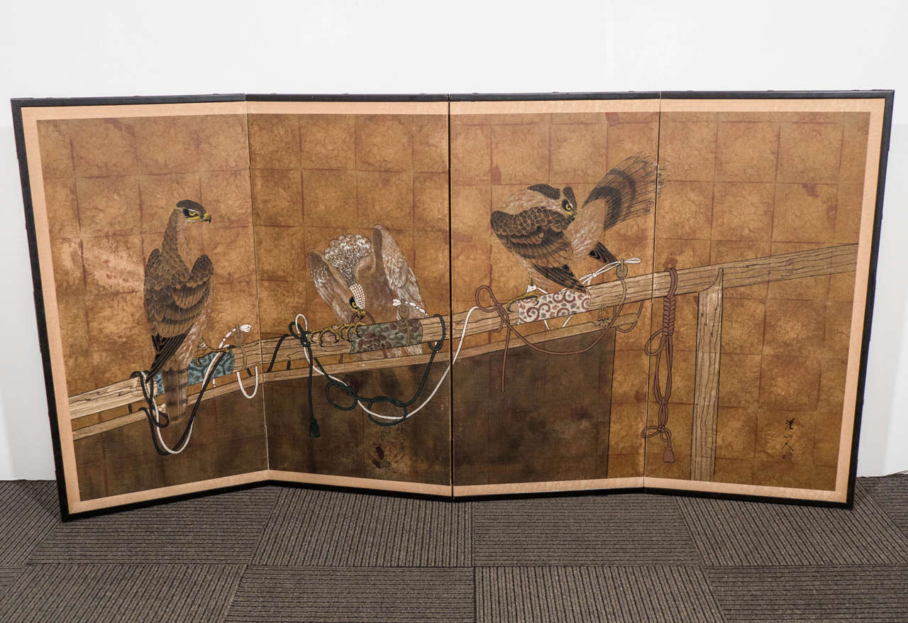An early 20th century Japanese four-panel screen, circa 1920s, decorated with tamed perching falcons. Good vintage condition with some age appropriate wear.