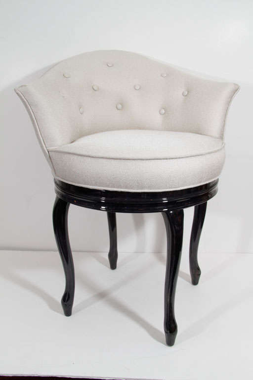 Glamorous 1940s Hollywood vanity stool with silver Bergamo silk/wool fabric featuring button back detail. Vanity stool features swivel seat and ebonized Mahogany Cabriole legs.