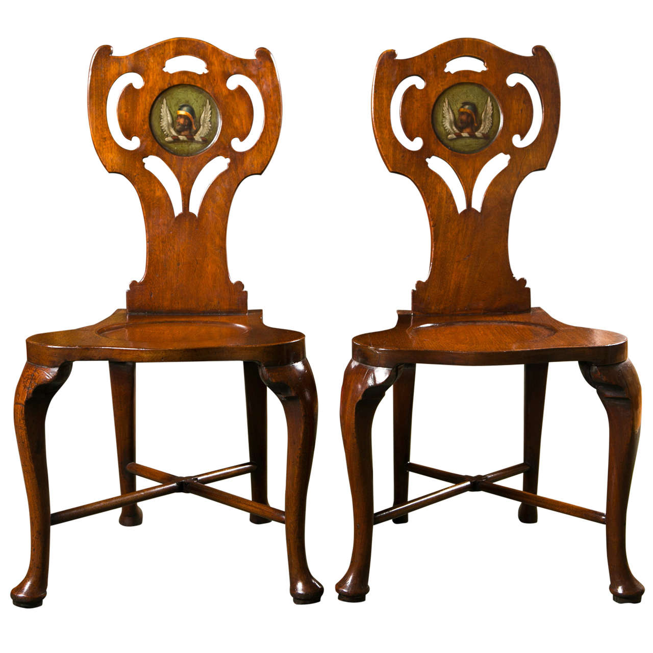  English George III mahogany hall chair with later armorial decoration. From the collection of Ann Landers.