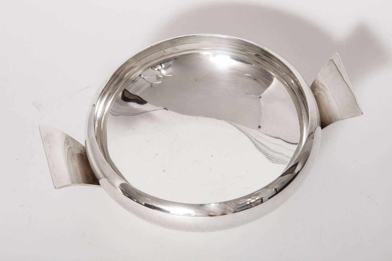 An Allan Adler Hand Hammered Sterling Bowl with Twin Handles, 
Studio City, California, circa 1955. Mint Condition, marked on underside of
handle, Allan Adler, Handmade, Sterling.