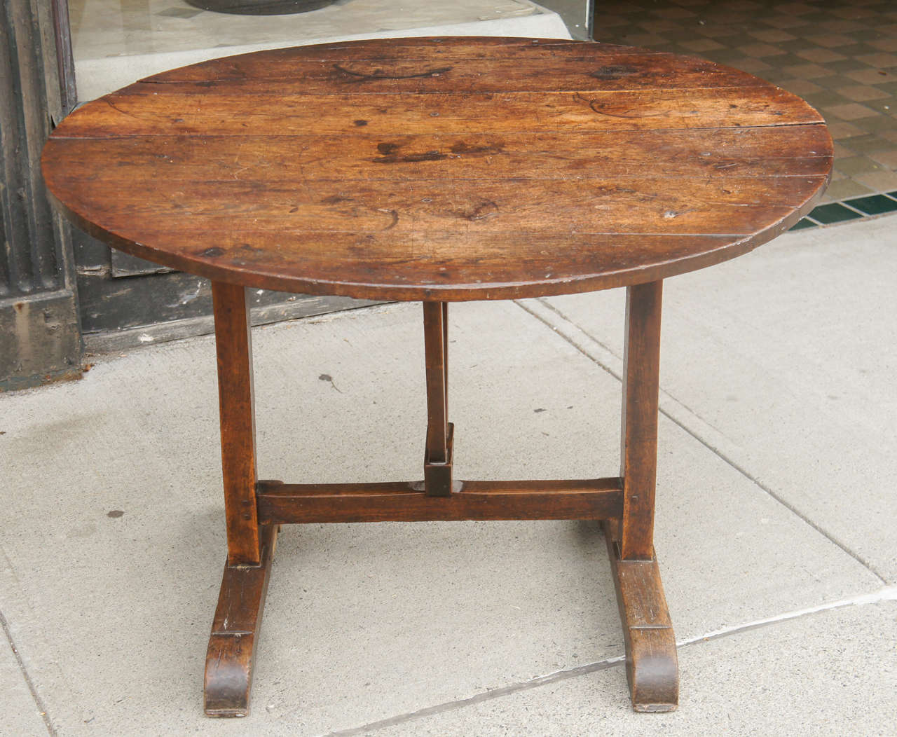 Country French wine table used in the wine cave and folds up for storage.