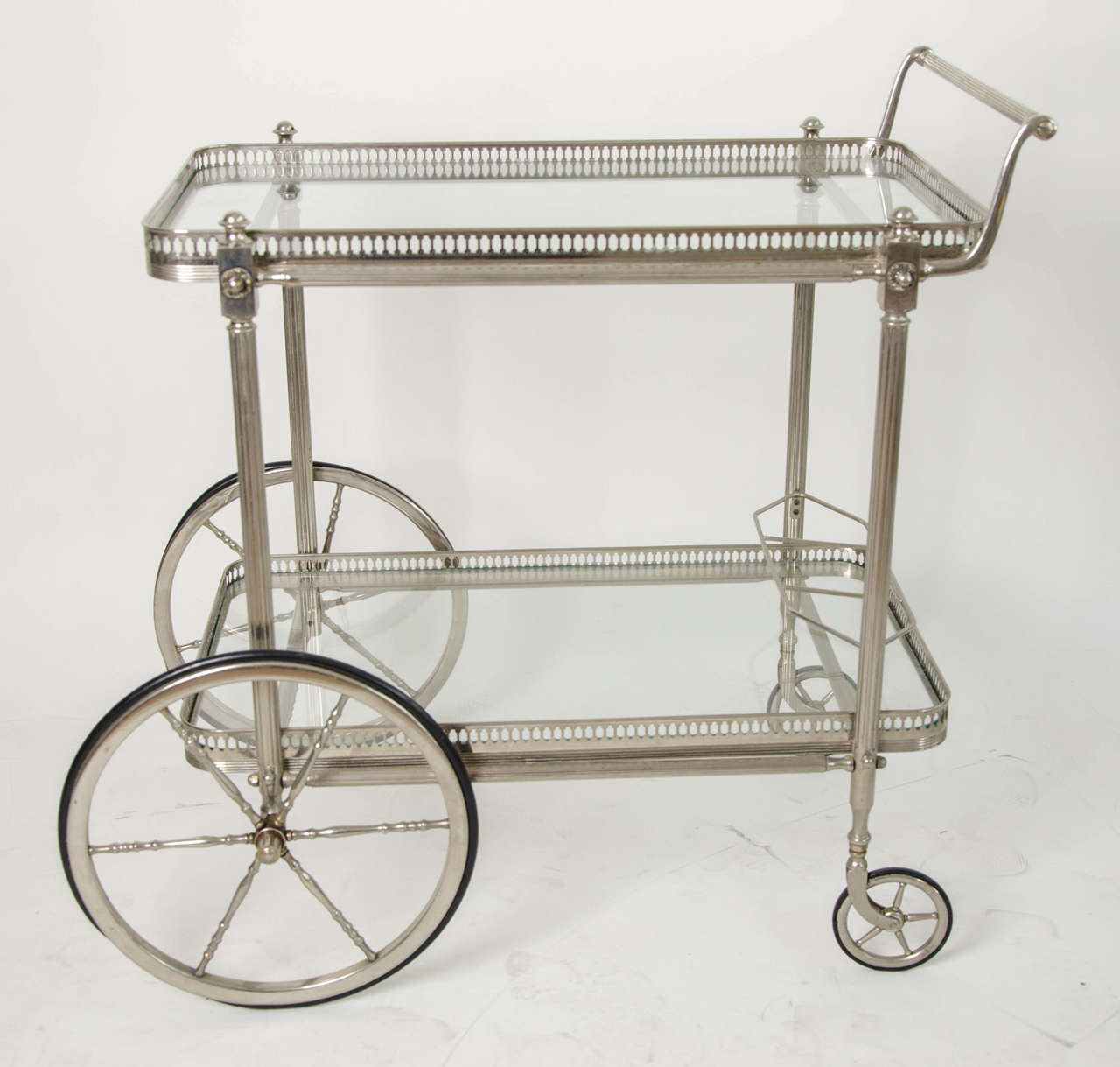 Very chic patinated Louis XVI style bar cart with both removable trays and a beverage holder.