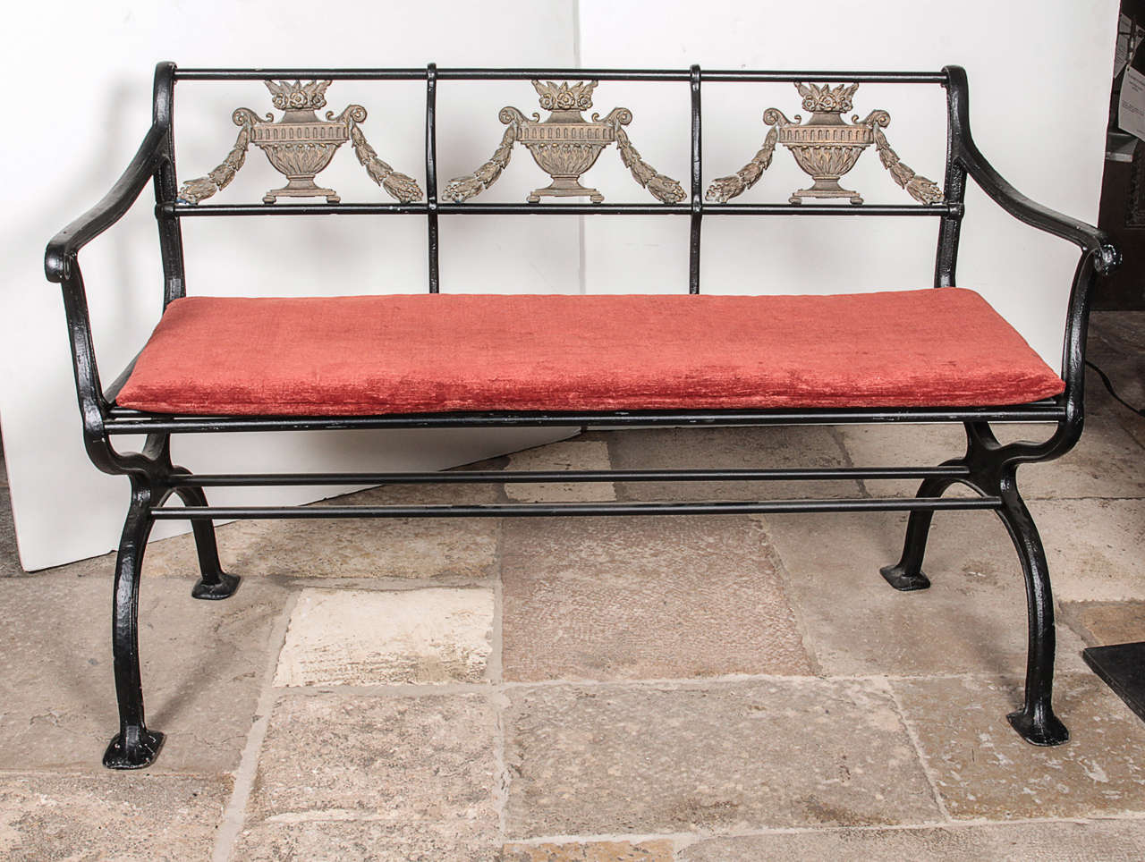 A fabulous set of Neoclassical cast iron and bronze seating, consisting of a bench, side chair and armchair. All are supported on curbed bases. American, circa 1910. Each piece includes a removable cushion. 

Bench:  30"H x 47"W x
