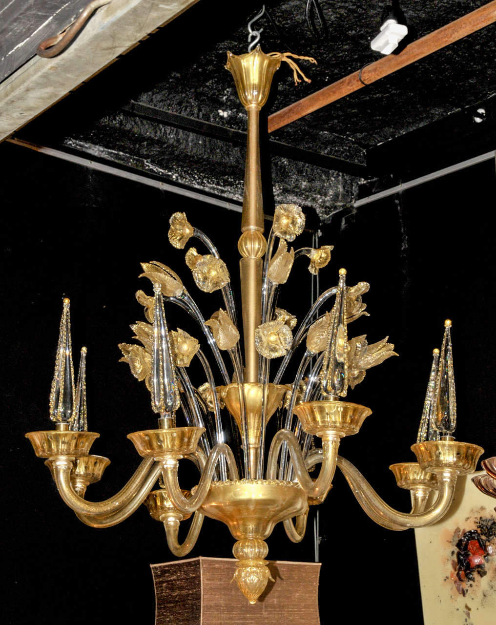 1960's Murano 'Bouquet' Italian chandelier. Gold glittered Murano glass with eight dagger like branches. Wired for European use.  Good condition. Normal wear consistent with age and use.