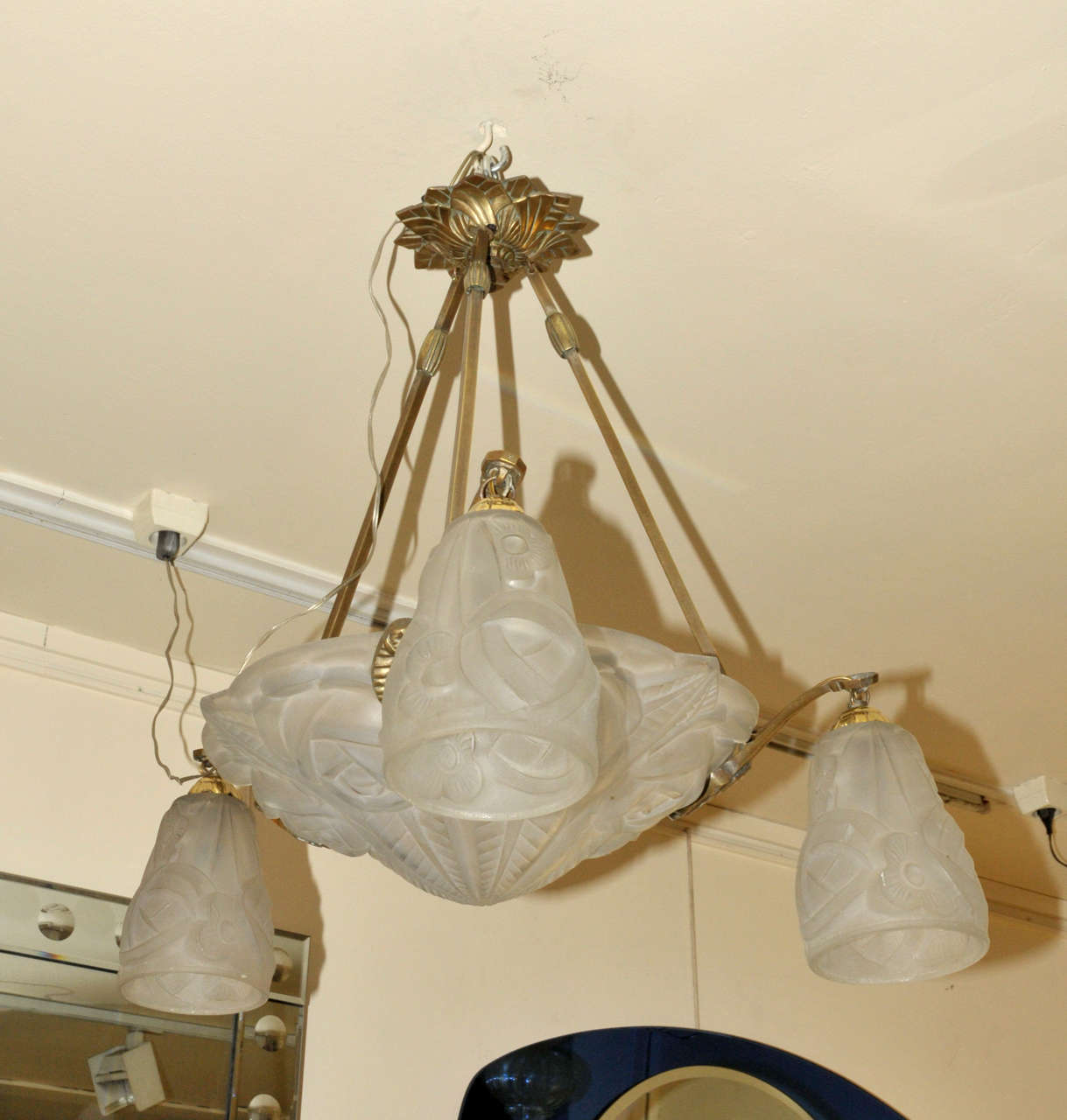 1930's glass and bronze chandelier. Three lighted arms. One inside light. Wired for European use. Good condition. Normal wear consistent with age and use.