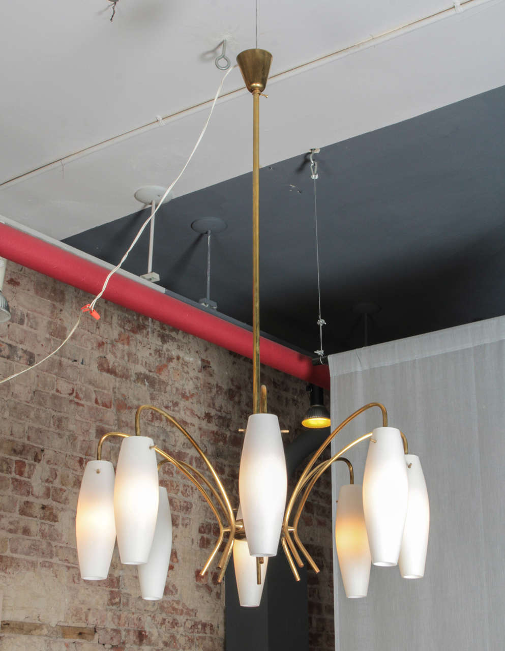 Simple and elegant Italian chandelier from the 1950s - full brass corpus matched with 8x suspended milk glass diffusers.