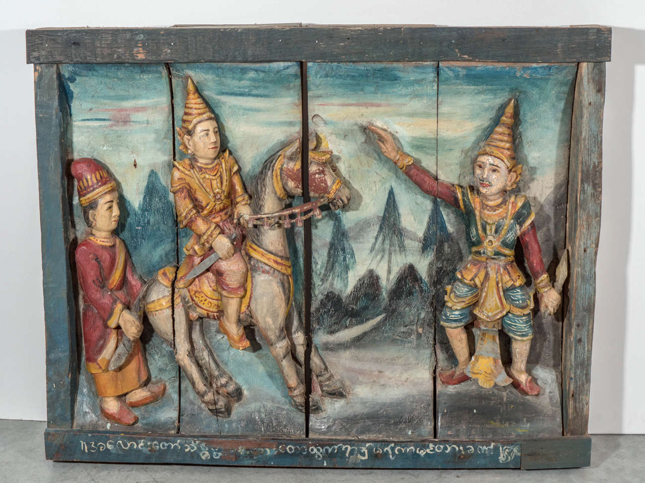 A very unusual and rarely seen three dimensional carved and painted Buddha story. This piece is part of a larger series of panels which together told one complete story. The piece contains great original paint and Burmese characters. Several pieces