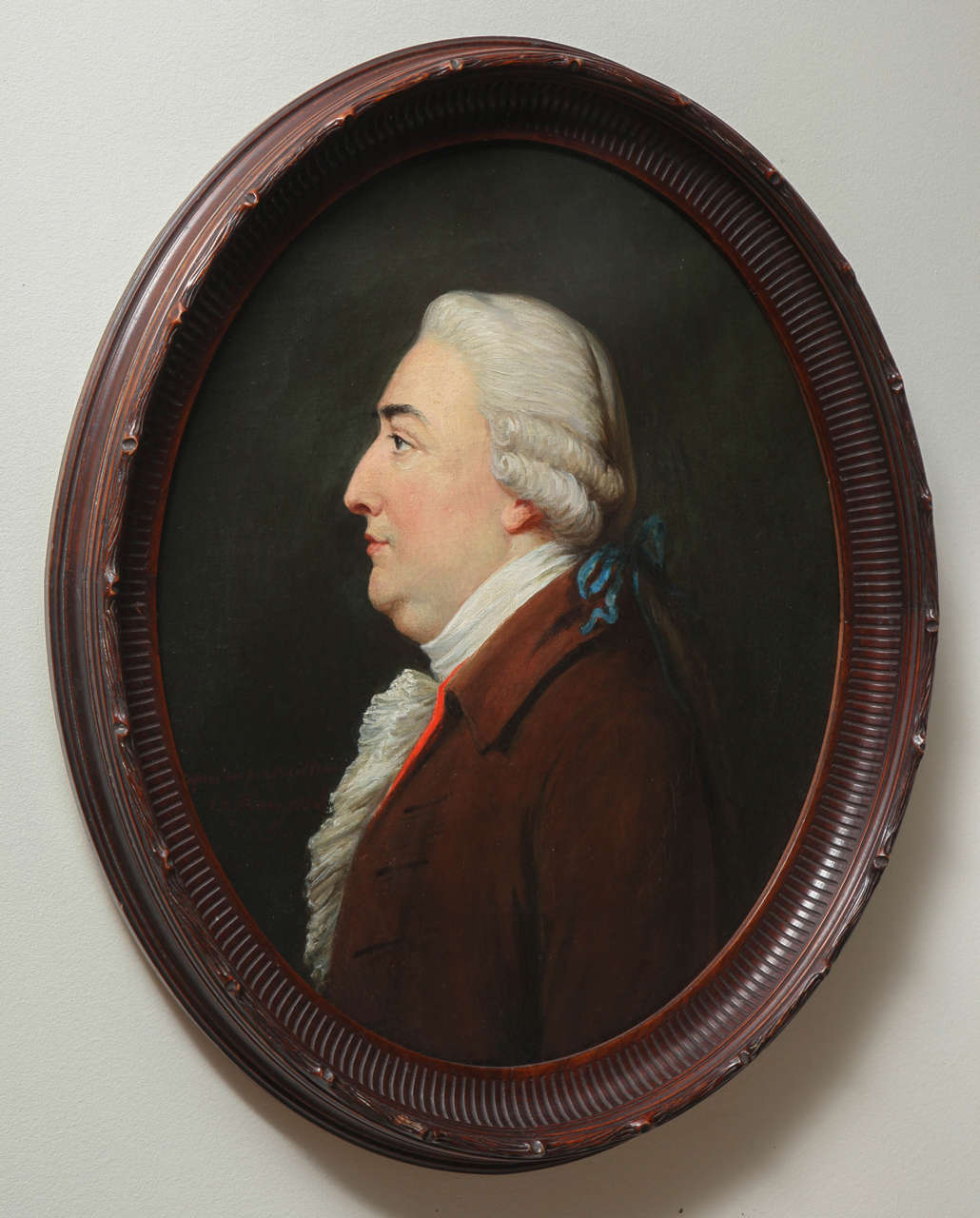 English Gentleman in oval carved wood frame.