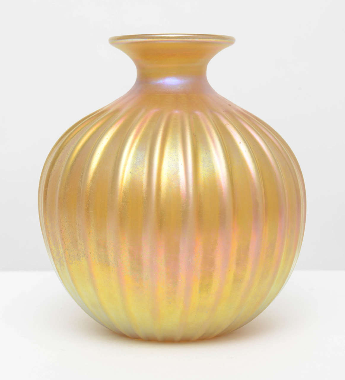 Gold toned Murano vase, handblown and rolled with a golden iridescent coloring that reflects the light in a number of shades.