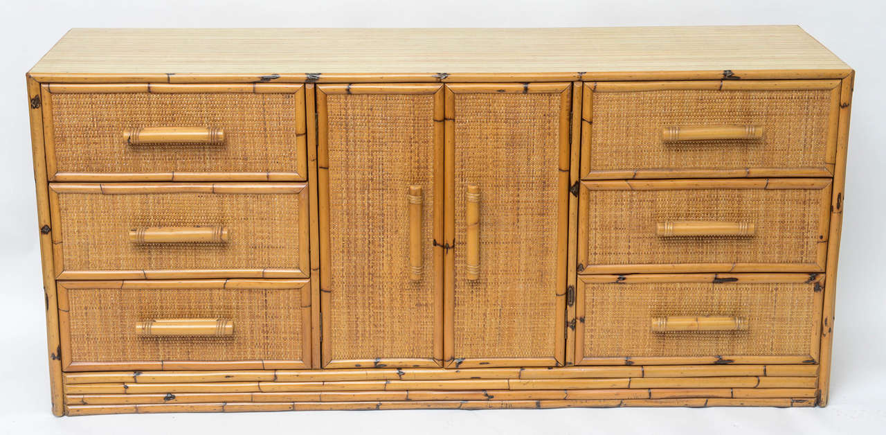 Rattan dresser with six drawers and centered doors. Recently restored.