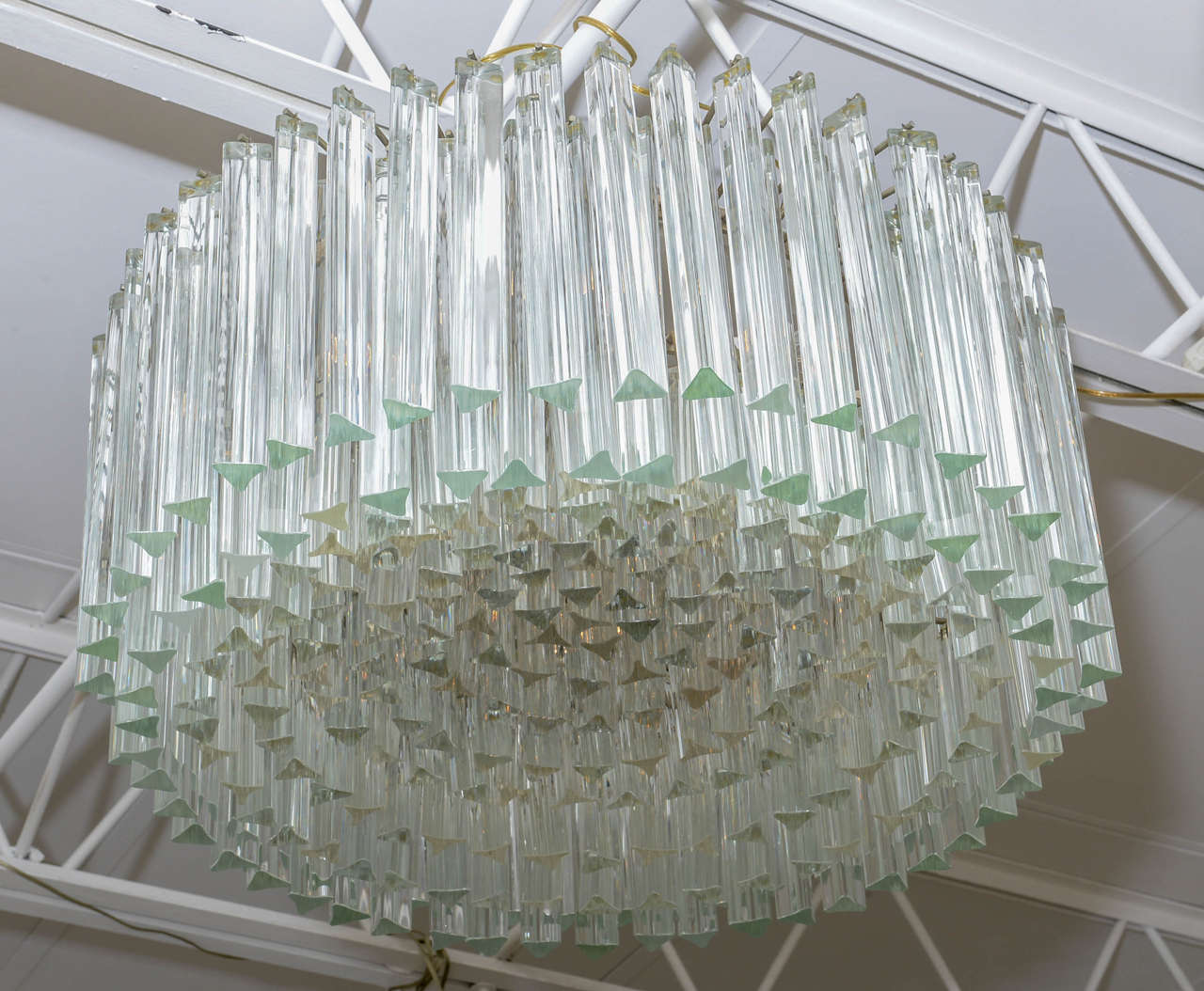 Camer chandelier with nine tiers of triedri prisms.