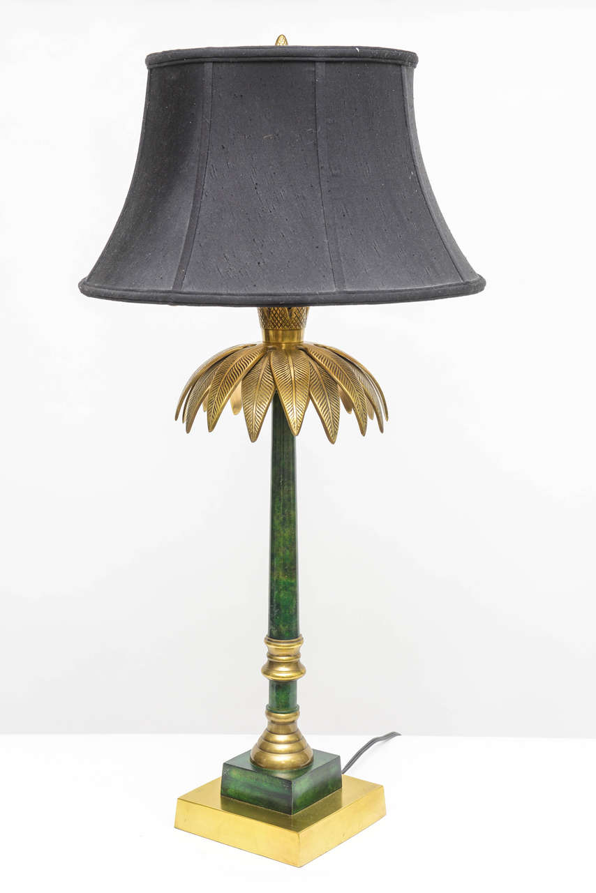 Original table lamp made by Wildwood of Rocky mount brass base and palm leaves. Metal column painted green/black. Original shade included. Three-way bulb 30-70-100W.