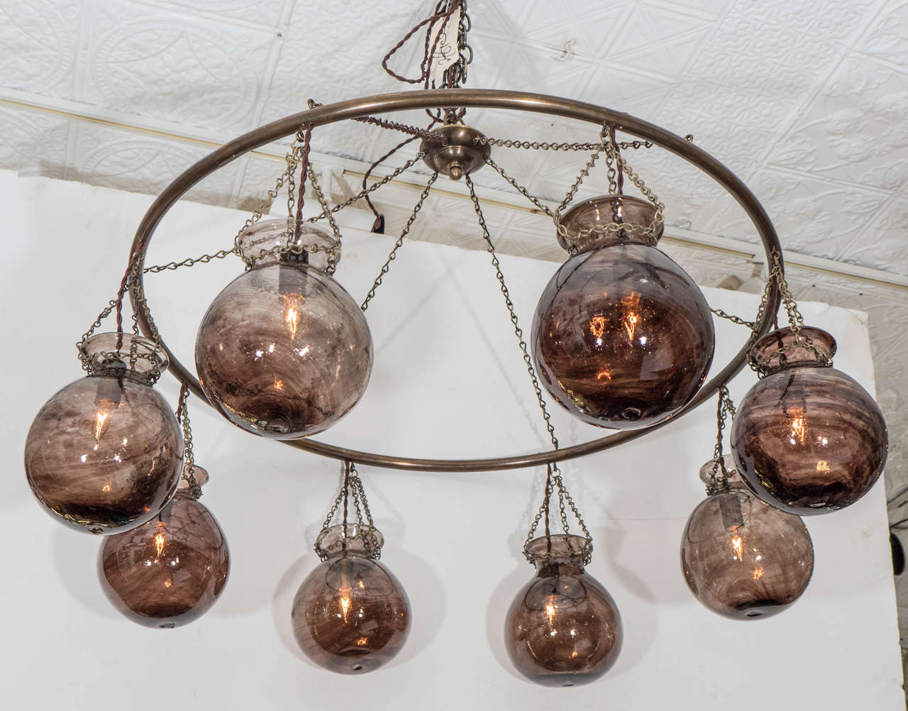 Egyptian handblown dusty purple globe chandelier with antique bronze ring.