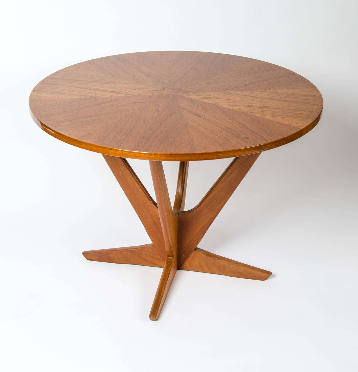 A 1960s coffee table designed by the celebrated Furniture Designer Holger Georg Jensen for Kubus of Denmark. It is beautifully made and the top features radiating teak veneers. It is in a good vintage condition.