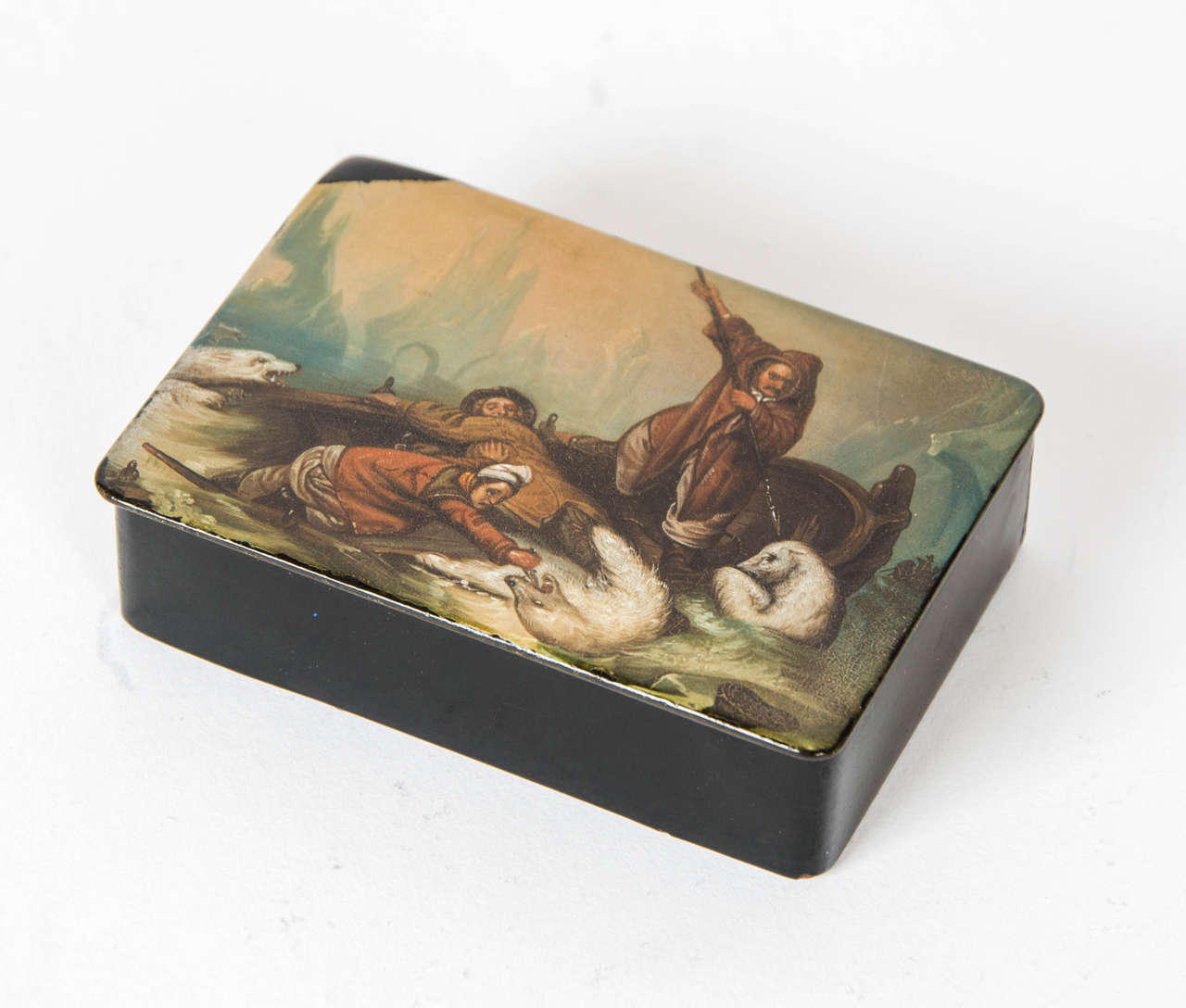 An early 19th century Stobwasser paper-mache snuff box painted with a very unusual scene of three shipwrecked sailors battling with three polar bears on a failed Arctic expedition. The inner lid signed Biard after the artist Francois- Auguste 