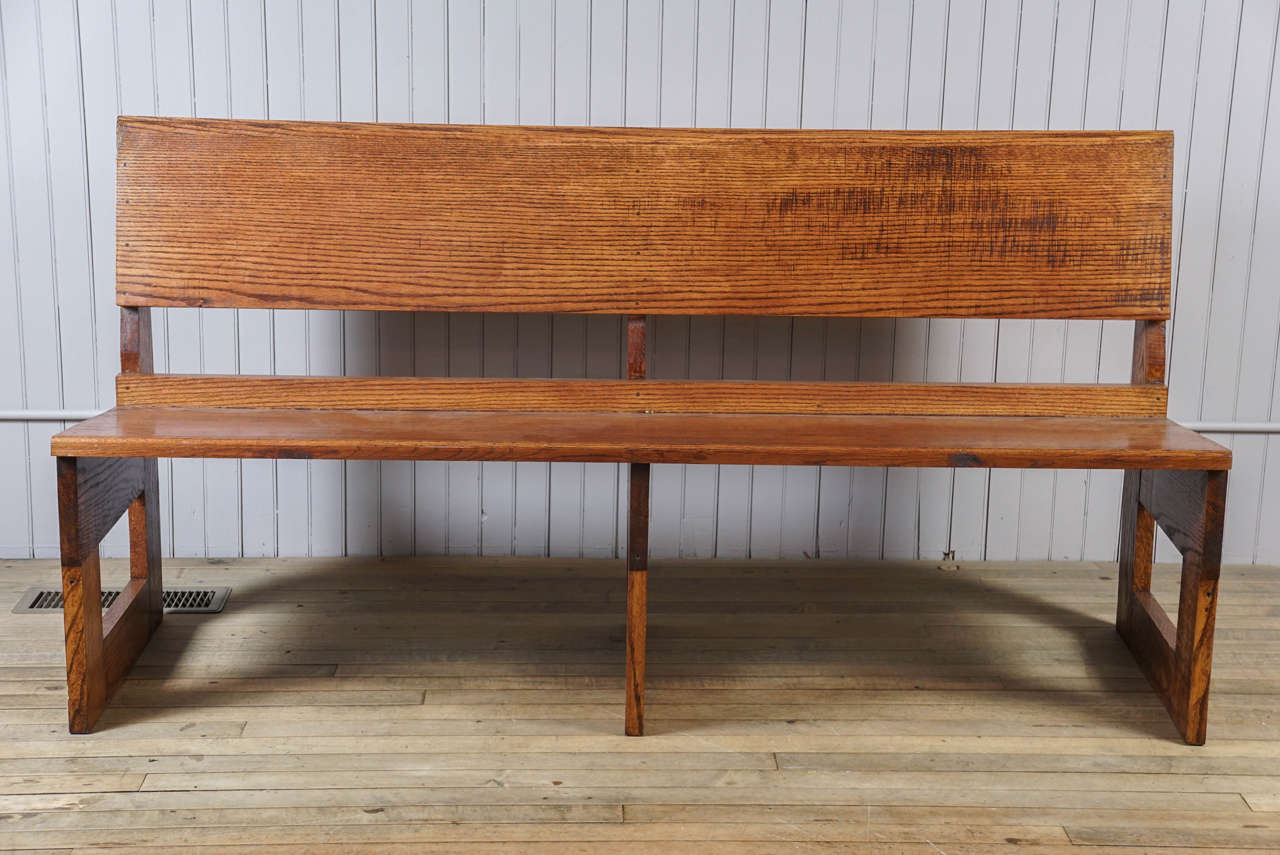 Quartersawn oak bench deep rich honey color, original patina, canted seat for comfort, simple bold direct design.