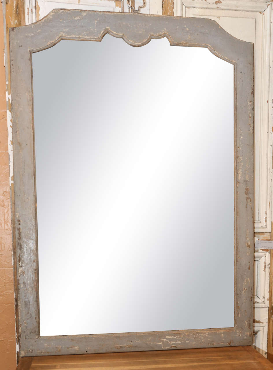 Painted and scraped mirror with shaped top.