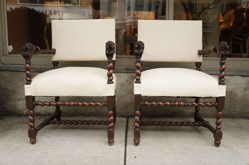 Antiques Louis XIII-style throne chairs with barley twist arms terminating in carved Lions and barley twist legs and stretchers.