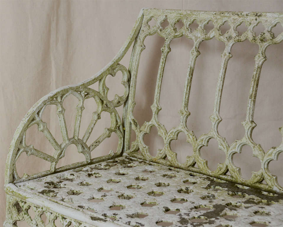 EARLY 19TH CENTURY GOTHIC STYLE CAST GARDEN BENCH WITH GOTHIC QUADRAFOIL MOTIF THROUGHOUT--ARMS HALF ROUND SPOKE DESIGN