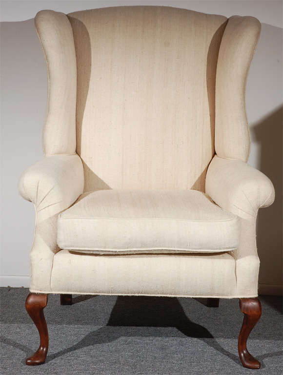 Fantastic form Queen Ann style wing chair with pad feet in raw silk linen .This wonderful comfortable chair has a great overstuffed form and down & feather cushion that makes it really great for comfort.The condition is very good and the chair is