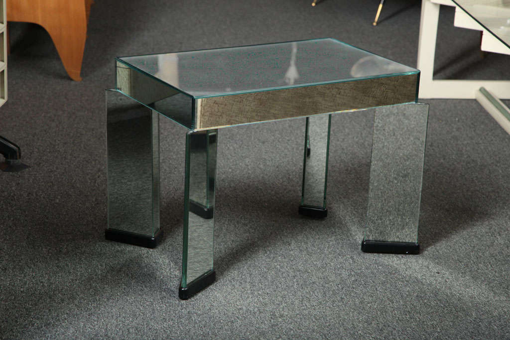 Elegant mirrored table with a stippled finish made in Italy designed in the 1930s.
Unusual beautiful made legs, down to the little triangular piece of glass at the top of the leg where it meets the tabletop.
Great quality.
  