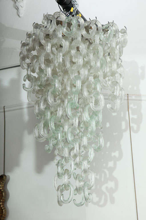 EXCITING LARGE CHANDELIER MADE IN VENICE 1960'S BY MAZZEGA, UNUSUAL CLEAR REED & LIGHT GREEN GLASS C SHAPED BLOWN GLASS LINKS. MADE SO THAT YOU CAN CHANGE THE LENGTH & SIDES TO WHAT EVER FORM THAT YOU WANT, GREAT QUALITY. CHANDELIER GO FLUSH TO