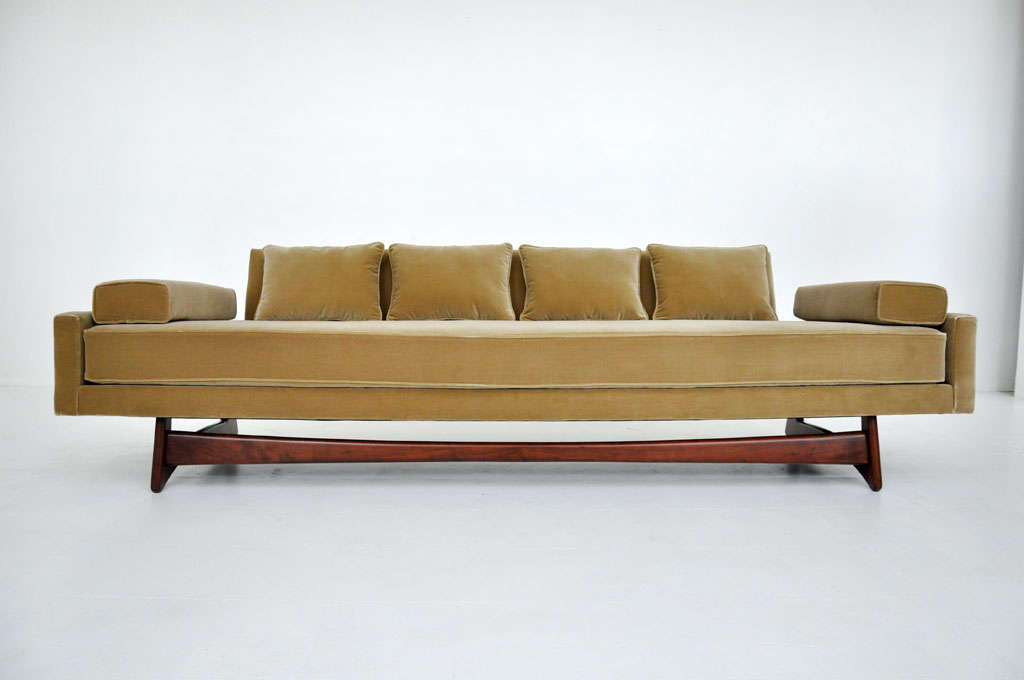 Gondola sofa by Adrian Pearsall.  Newly upholstered in velvet.  Seating floats on sculptural walnut frame.

Color of fabric is more mossy green than it photographed.