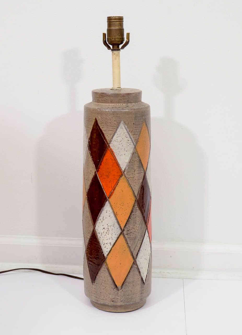 Store closing-- last day is 7/31. Offers welcome! Ultra cool art pottery lamp incised and glazed in a playful Harlequin pattern.  Made by Bitossi and imported by Raymor circa 1961. Measures 22