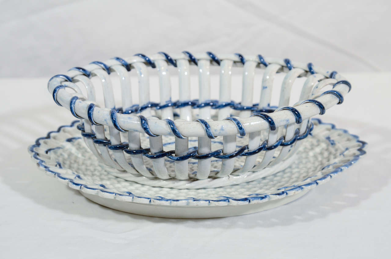 A pair of creamware baskets & stands, Georgian period c1785.
The creamware oval basket with pierced edge and basket weave design with blue enamel strapwork.
Made by and with the marks of Heath of Hanley.
A similar basket c1780 is illustrated in