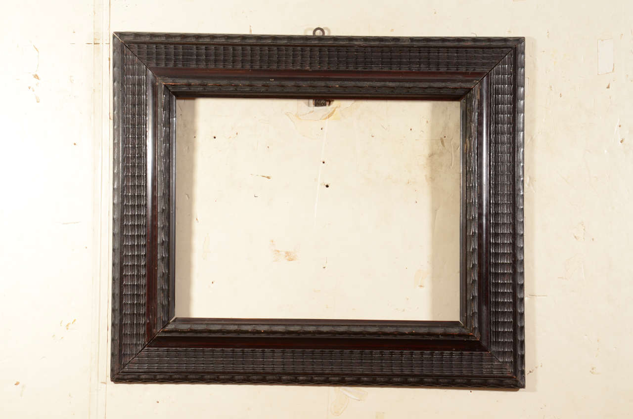 Handsome reverse profile rippled frame, original metal hanging loop.  
Exterior dimensions: 21 x 25 inches
Rabbet dimensions: 17 7/8 x 14 inches
Moulding Width: 4 inches

Mirror (flat or beveled) can be added at an additional cost.