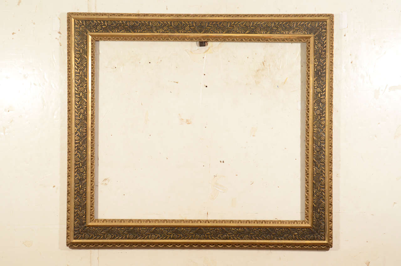 Gold leaf flat panel decorated with a sophisticated Aesthetic Movement pattern, flanked by egg and dart composition ornament, circa 1880
Exterior dimensions: 28 1/8 x 32 inches
Rabbet dimensions: 26 x 22 inches
Moulding width: 3 3/8