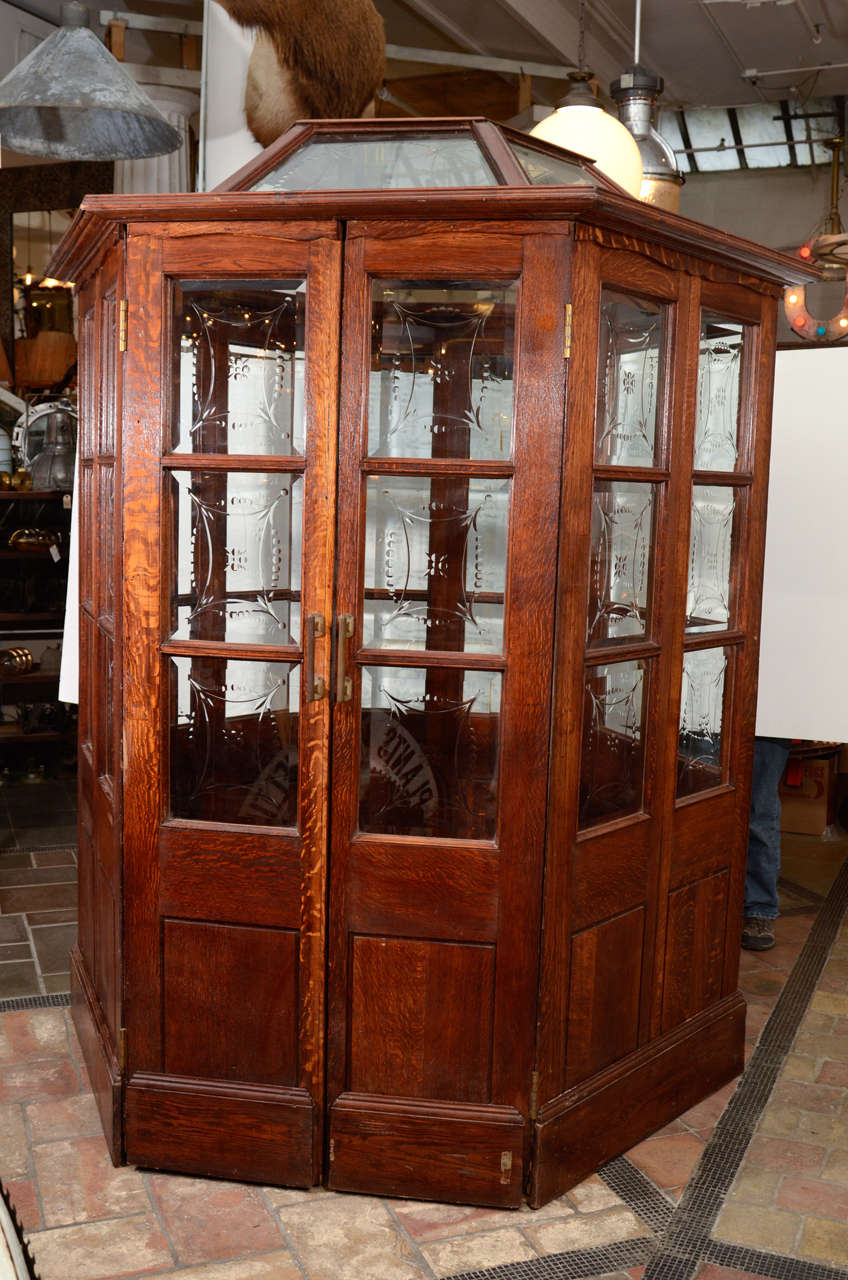 This 19th century English oak salesman's booth originally belonged to one of the 14,000 exhibitors in the 1851 London Crystal Palace. This booth has been carefully restored with matching replacement etched glass. Features restored English oak